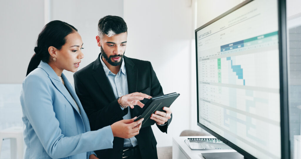 Tablet, reading and happy business people talk about insight, analytics or stock exchange trading. .